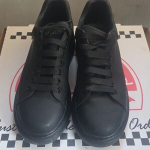 Alexander McQueen Black Leather Low-Top Sneakers with Gold Logo